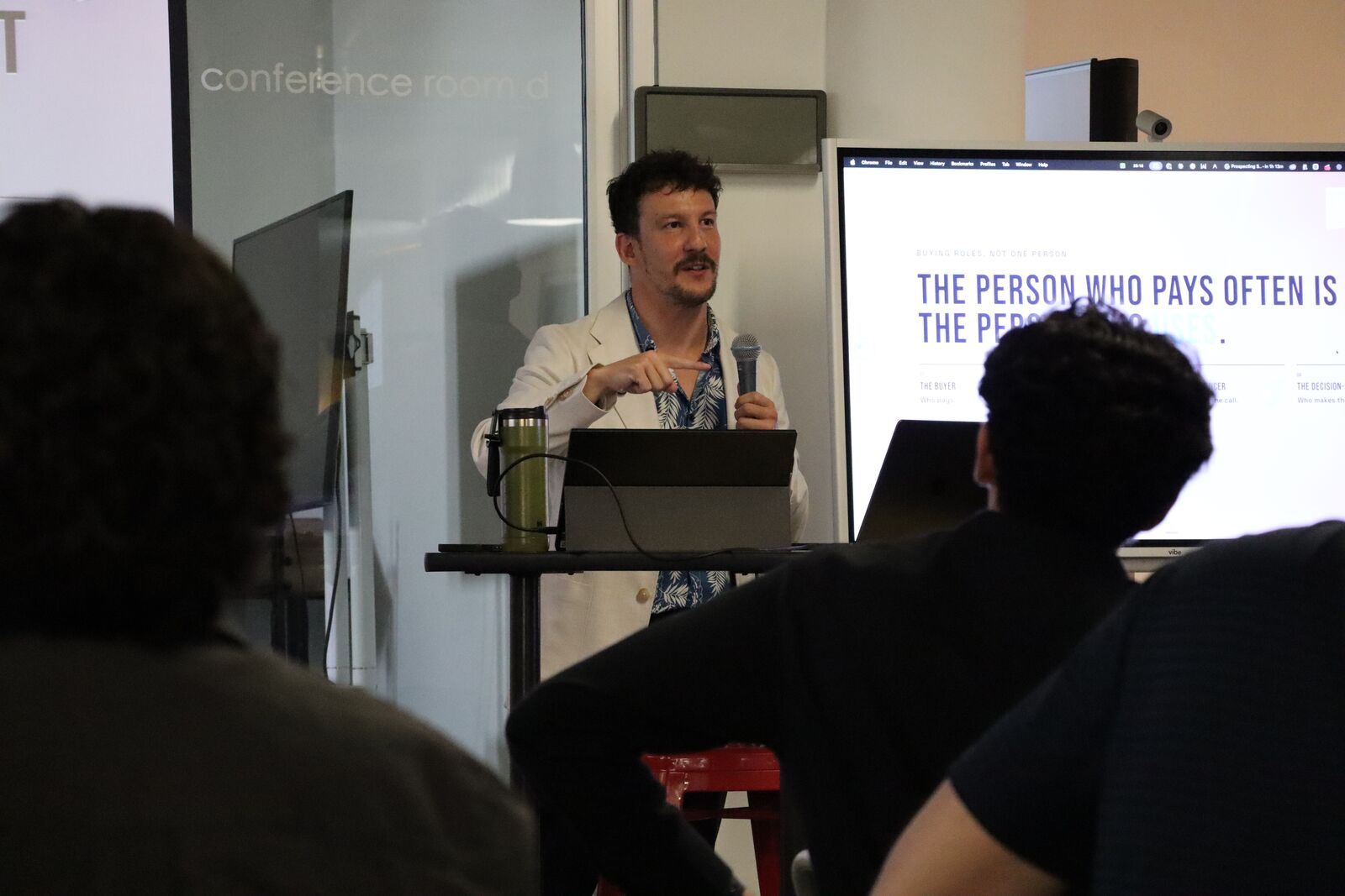David speaking from a podium with a microphone at an event
