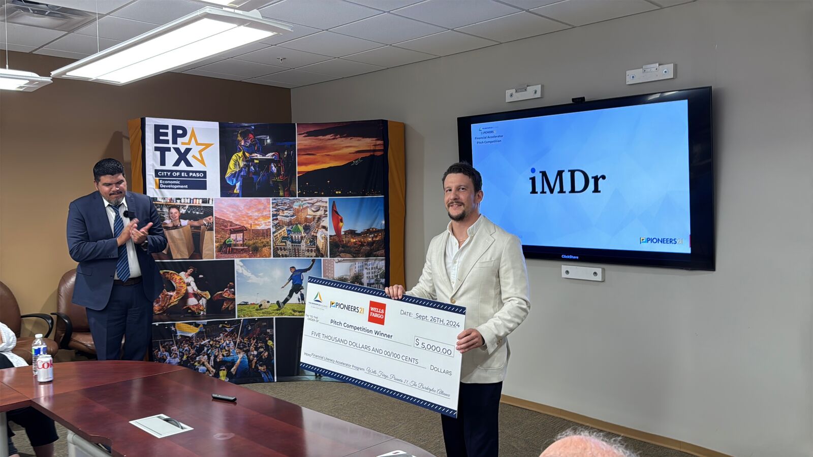 David holding a $5,000 pitch win check at Pioneers 21