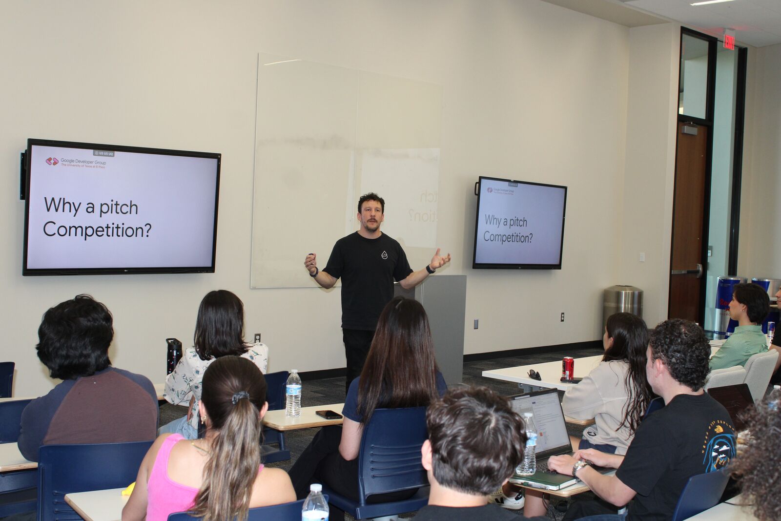 David opening a GDG pitch competition in front of judges and audience